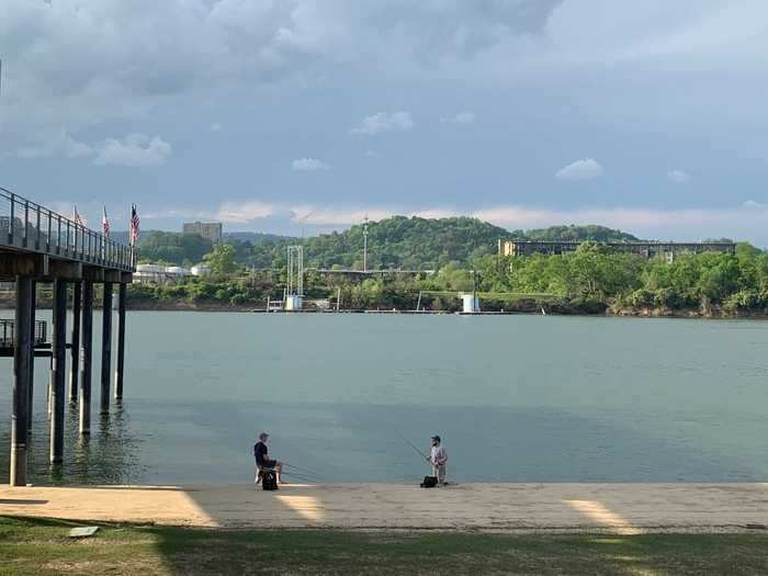 This part of the riverfront is usually packed with families playing together and people out on their runs or bike rides. When I drove by the closed river park on April 8, all I found were a few groups of people — who seemed to be heeding social distancing measures — posted up there alone with fishing poles.