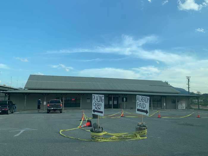 Other local businesses were more successful at keeping shoppers apart. Riverside Wine and Spirits set up a makeshift drive-thru so customers didn