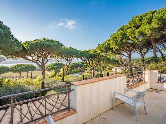 ... and its terrace looks out over a highly manicured garden toward the ocean.