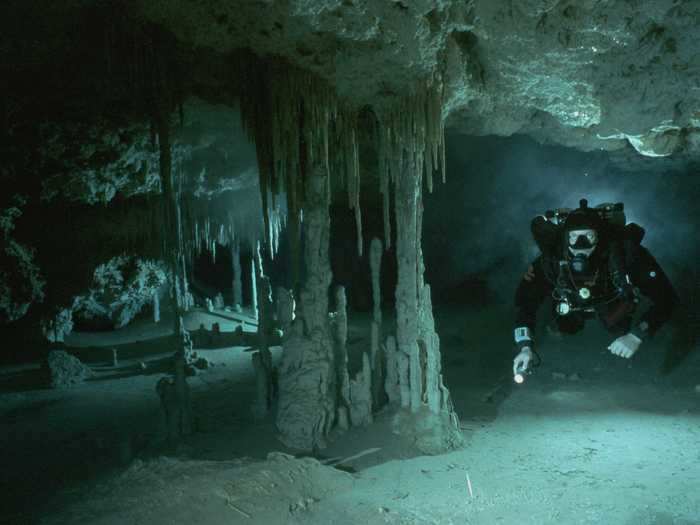 A diver explores a spooky underwater cave in the Sac Be Ha Cenote in Quintana Roo, Mexico.