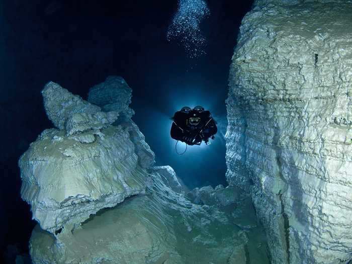 Cave divers from the Orda Cave Awareness Project explore the beautifully transparent Orda Cave in Russia