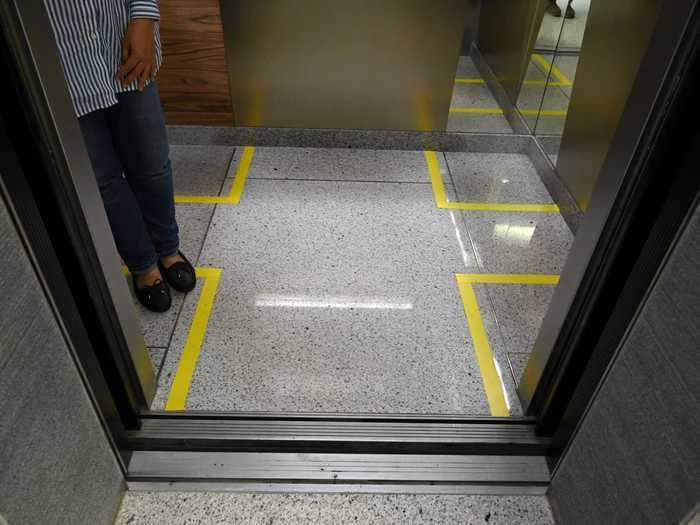 Designated spots in elevators: To avoid overcrowding, there is also yellow tape on the floor inside the elevators denoting where employees should stand on the way up to their office space.