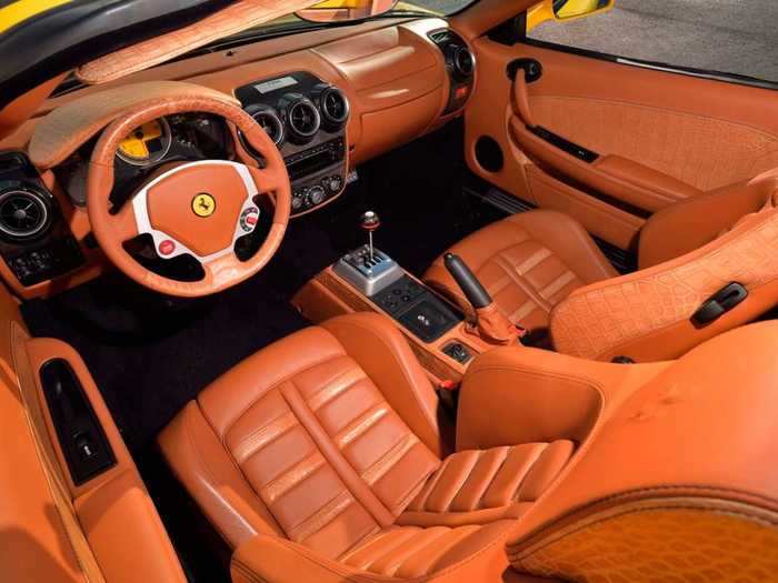 The seats are upholstered with Schedoni tan natural leather with Daytona-style seats.