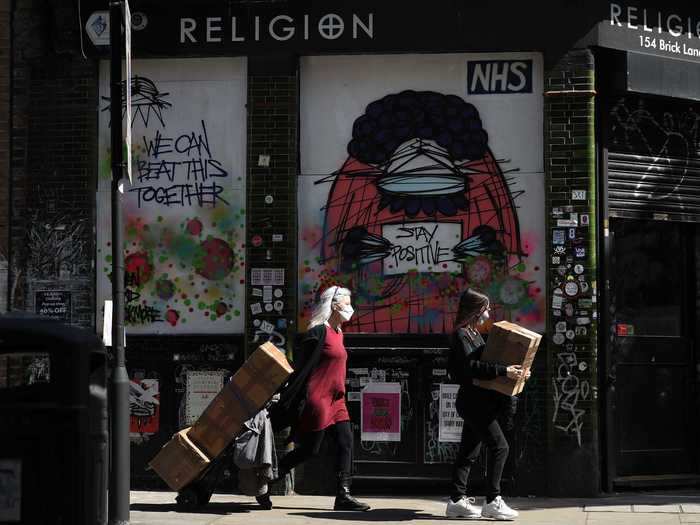 Street art in London encouraged passerby, saying, "We can beat this together."