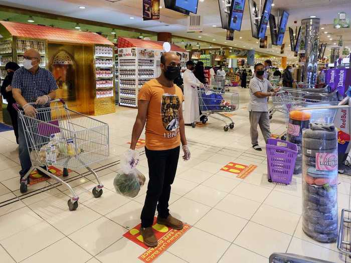 One method seen in most countries involves using markers on the floor to help people comply with social distancing guidelines. From supermarkets...