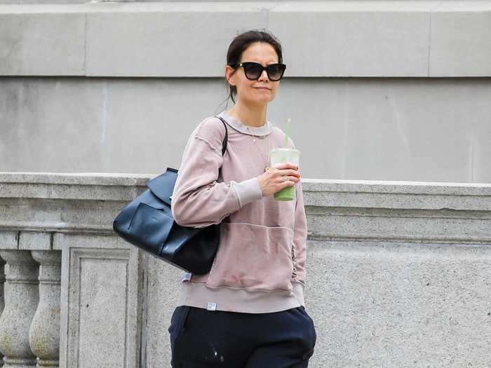 On her way to the gym, Katie Holmes was seen wearing sweats and a purse.