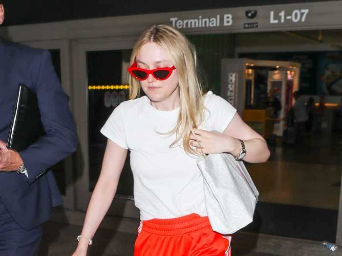 Dakota Fanning paired her bright red sweats with a simple white T-shirt.