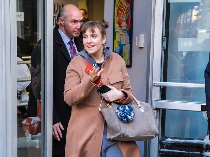 Lena Dunham was photographed leaving a taping of "AOL Build" in New York City wearing sweatpants and a long coat.