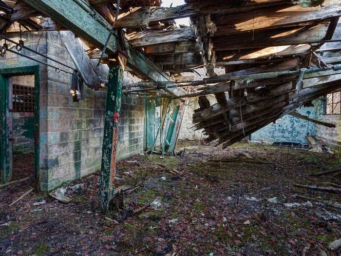 Most buildings on the 33 acre site are covered in broken pavement and glass, and some roofs are collapsing, likely making them unsalvageable.