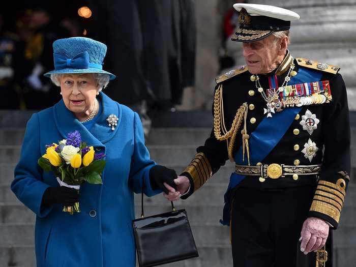 They held hands on their way out of a memorial service in 2015.