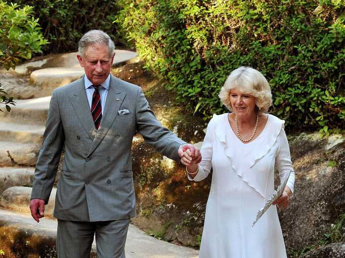 While visiting Rio de Janeiro in Brazil, they held hands as they walked through botanical gardens.