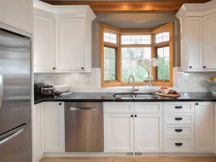 Give worn and outdated cabinets a fresh coat of paint to make them look new.