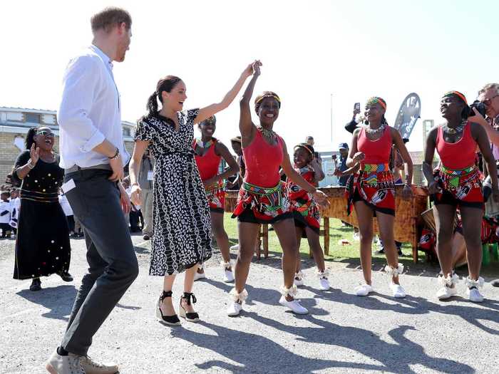 The Duke and Duchess of Sussex kicked off their first official tour of Africa by dancing with locals in Cape Town on September 23.