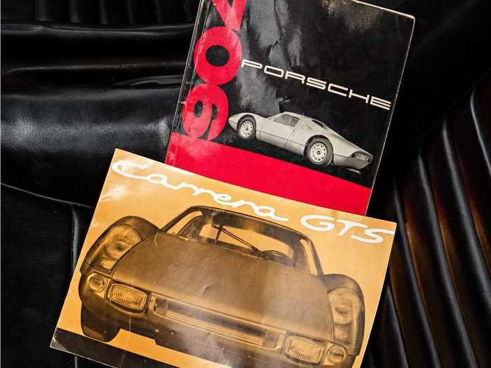 The Porsche even comes with an original sales brochure and owner’s manual.