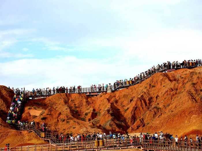 Hikers from around the world visit the Zhangye National Geopark, which is home to colorful mountains.