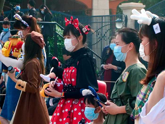 Instead, visitors are spaced out in the lines as they wait to enter the park.