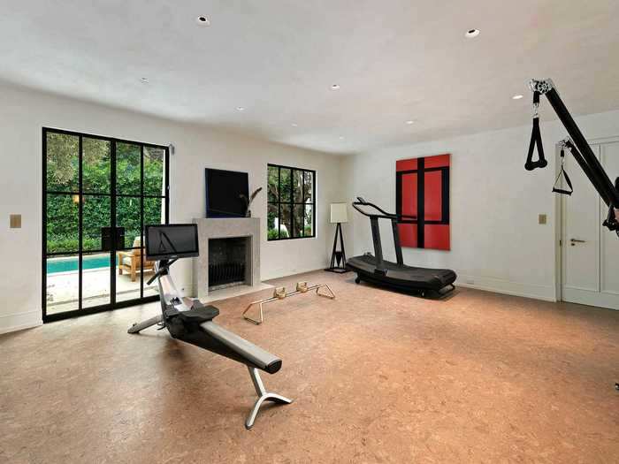 A fitness center overlooks one of the pools.