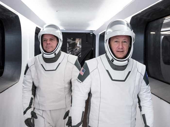 ... Then walk down an access arm to their spaceship. Just before boarding Crew Dragon, the astronauts will give a family member a traditional phone call. "Hopefully, we get a person and not an answering machine," Behnken said on May 1.