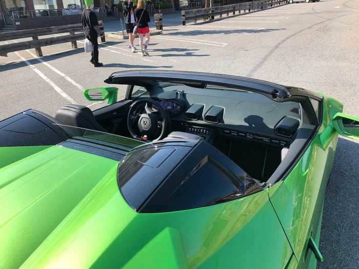 The top folds into a compartment between the engine and the cockpit. A small windscreen cuts down on buffeting for driver and passenger.