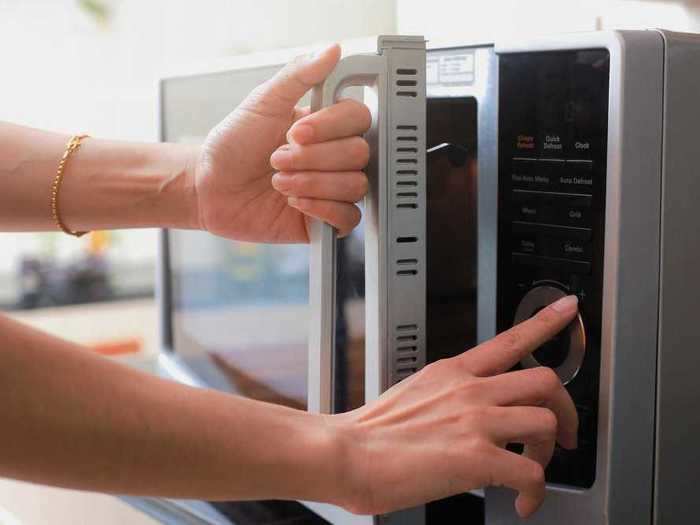 After disinfecting the handles and knobs, be sure to also wipe down the buttons on your stove, microwave, and other common kitchen appliances.