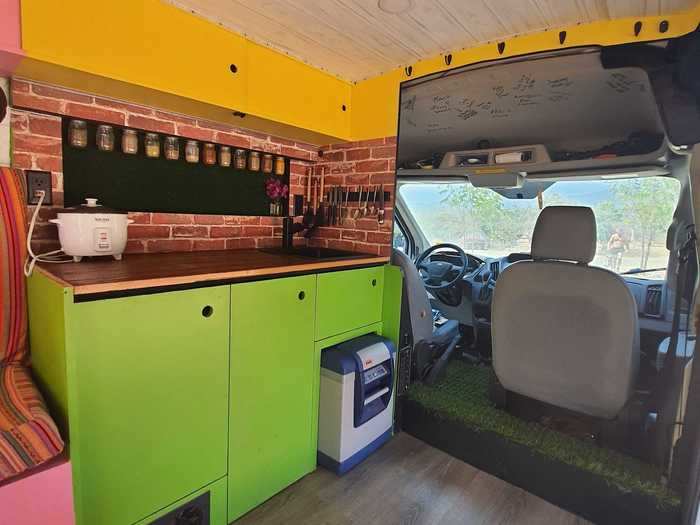 The van is equipped with a stocked kitchen and plenty of storage space.