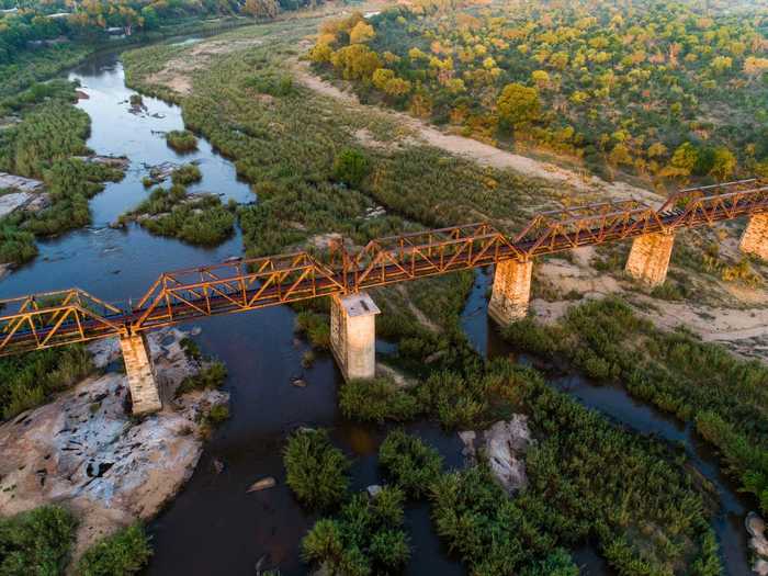 Twenty-four hotel rooms built in converted train carriages will open on the historic Skukuza Bridge in South Africa