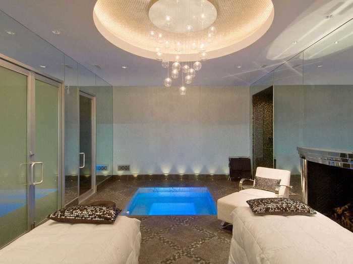 ... and a spa with fireplace, in-floor Jacuzzi, hydraulic massage tables, sauna, steam room, and showers.