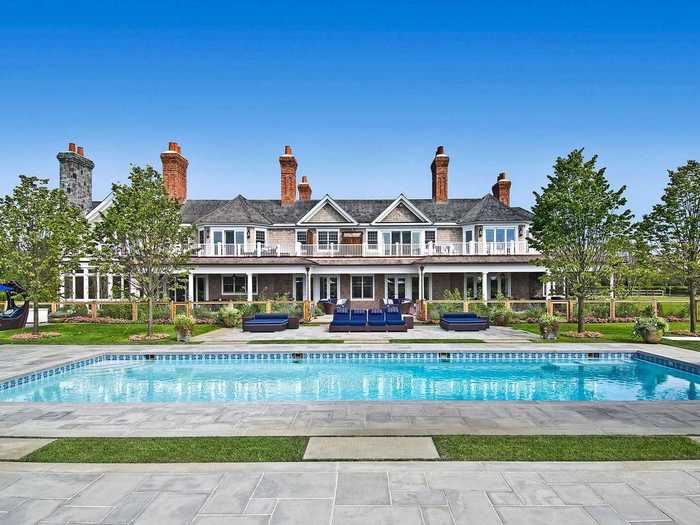 The main house overlooks the 60-foot by 20-foot heated pool, which has an underwater speaker system.