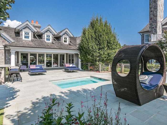 A 2,400-square-foot pool house includes two bedrooms, multiple yoga and studio rooms, and an underground hot tub out back.