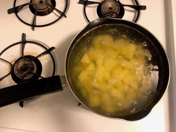 I added the potatoes to a large boiling pot of water, which I had seasoned with two tablespoons of salt.