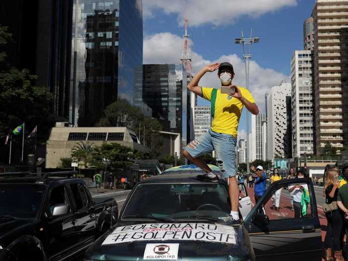 Some people have opposed the lockdowns, taking to the streets of Brasilia to demand that restrictions on movement introduced to stop the spread of coronavirus be lifted.