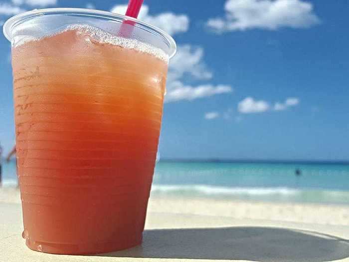 Visit Jamaica by sipping a rum punch.