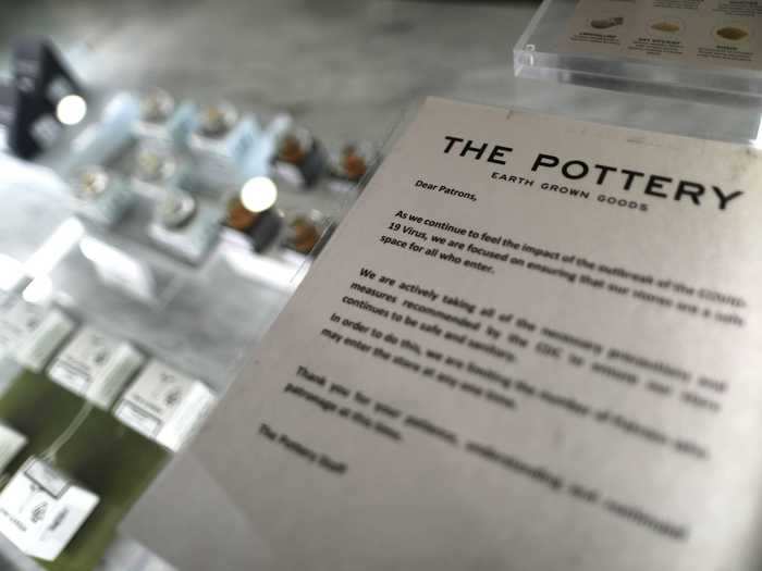 A delivery advertisement at The Pottery Cannabis Dispensary notifies customers that the number of people who can enter the store at one time will be limited.