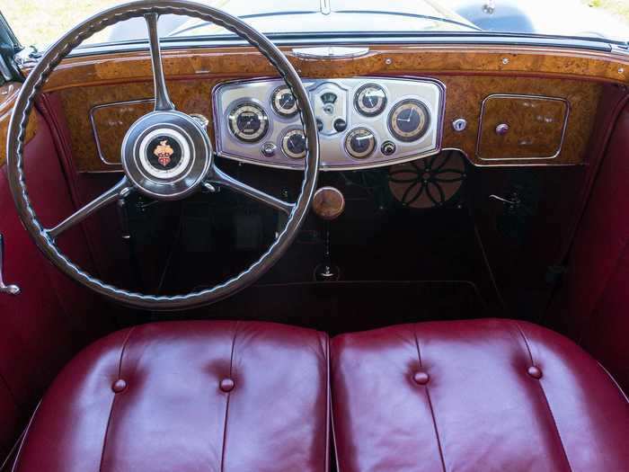 The wood and leather used inside make it look like a gorgeous boat cabin.