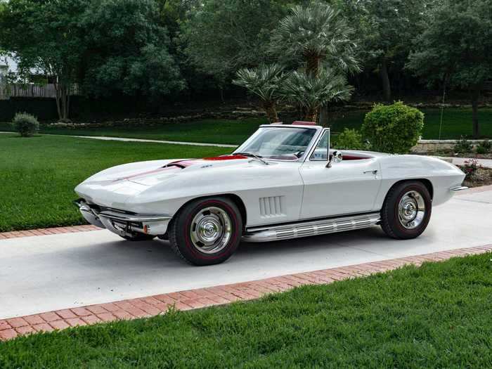 This pristine white example is a 1967 Chevrolet Corvette Sting Ray 427/390 Convertible.