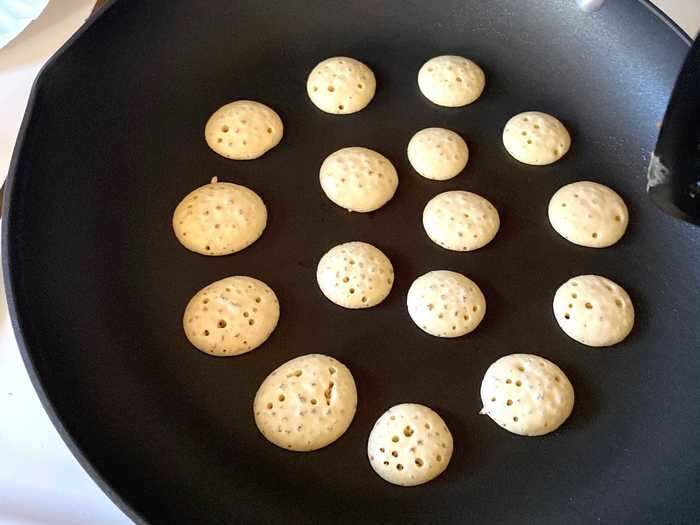 All you need to make the bowl of miniature pancakes is some batter and something to squeeze it out of.