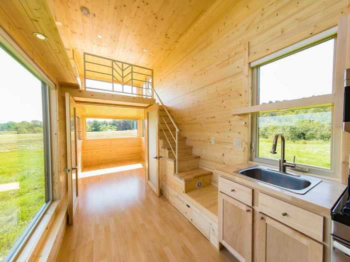 Storage includes closets and drawers that are built into the staircase that leads up to one of the lofts. The other loft can be accessed with its respective ladder.