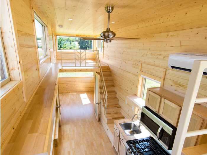 The home is insulated with closed-cell foam. But for additional temperature regulation, the tiny home also comes with a ceiling fan, an air conditioning unit with a heat pump, and a furnace.