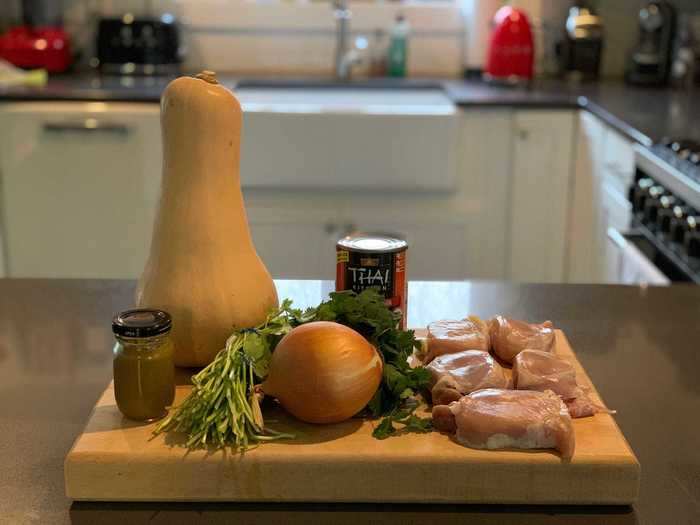 When he gets back to the house, he starts making dinner while his wife wraps up her work. On the menu: chicken and a butternut squash in the oven with some curry paste.