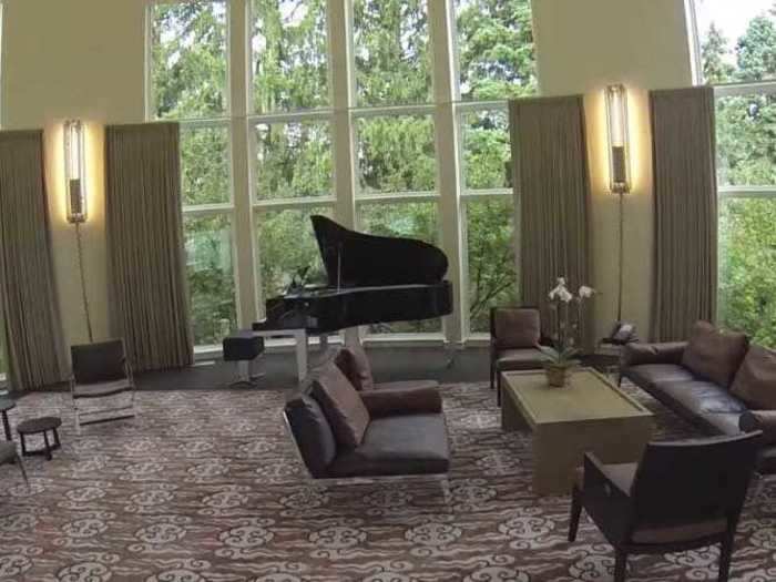 The piano room doubles as one of many sitting rooms in the house.