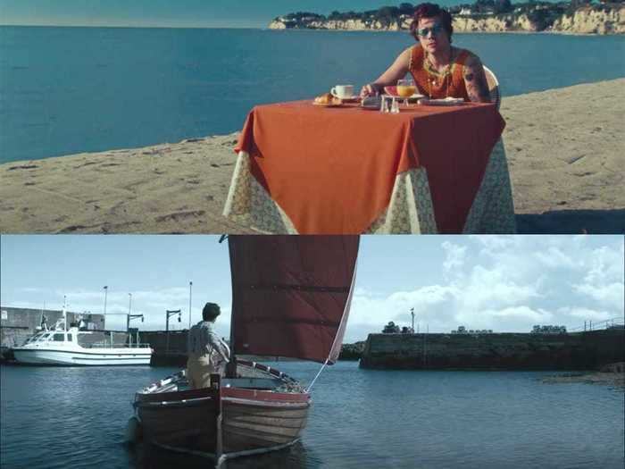 At the start, Styles is sitting at a table, which has a tablecloth reminiscent of the sail used in the video for "Adore You."