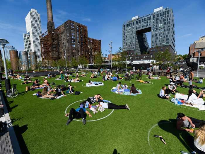 White circles painted on the grass designate spots where groups and families can relax while maintaining social-distancing protocols.