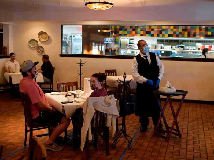 In restaurants, dining rooms opened and tables were mostly sectioned off six feet apart. Under the new orders, restaurants may allow up to six people to be seated at one table.