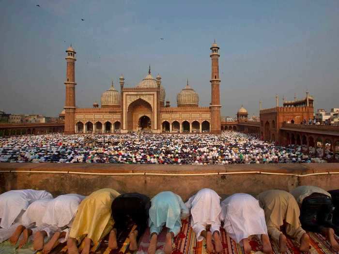 In New Delhi, India, Muslims pray at the Jama Masjid mosque in the early morning.