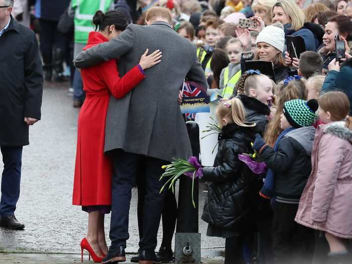 They wrapped their arms around one another during a walkabout in Birkenhead, England, on January 14, 2019.