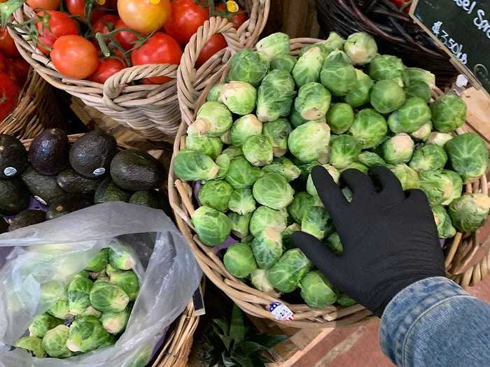 Shoppers are also required to sanitize their hands when they walk in and wear gloves when handling unpackaged fruits and vegetables. Only five people are allowed in the produce section at a time.