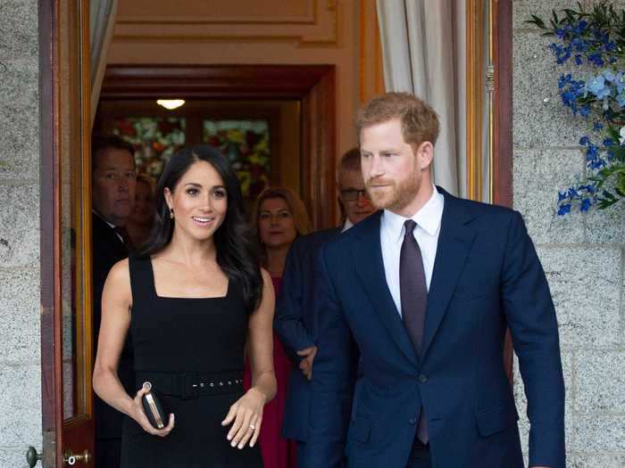 During a July 2018 reception in Ireland, Markle went for a classic black dress while Harry looked dapper in a navy suit.