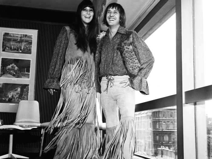 Cher and Sonny wore matching fringe outfits for a press event in 1965.