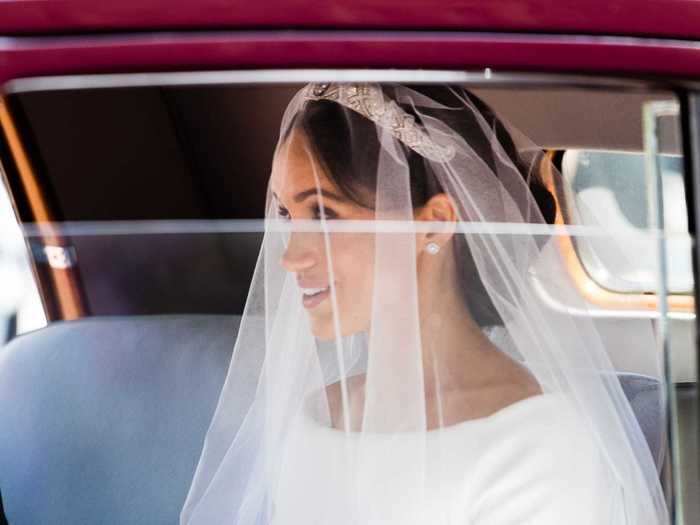 Fans got a first glimpse of Meghan Markle in her wedding dress when she arrived by car outside St Geroge