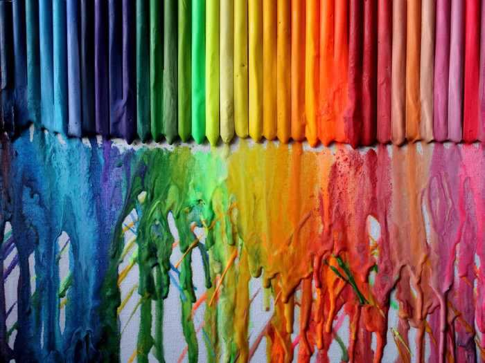 Make a colorful piece of art with crayons, a canvas, and a hair dryer.